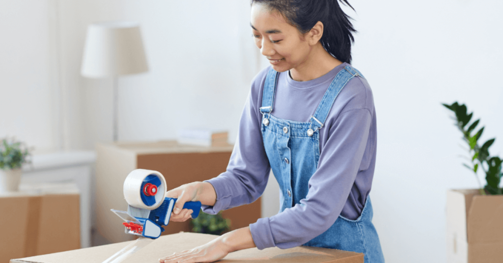 Person taping up a box