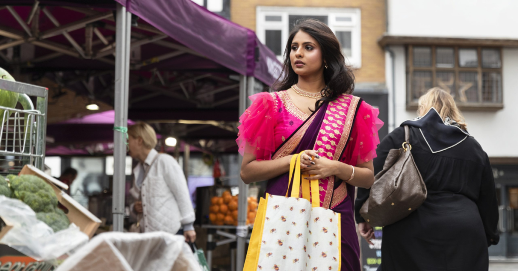 front view woman carrying shopping bags