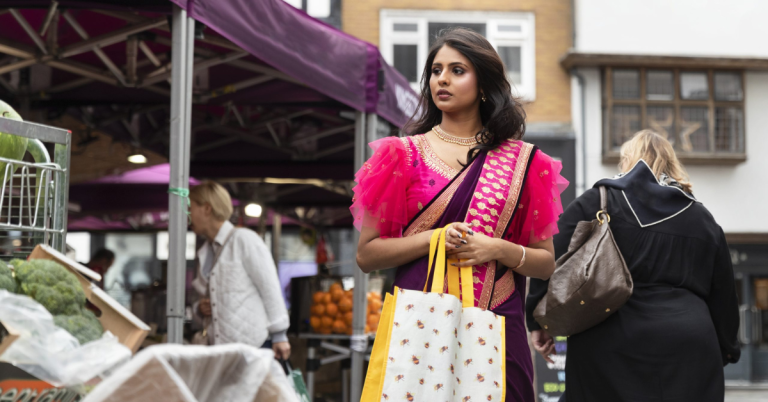 front view woman carrying shopping bags