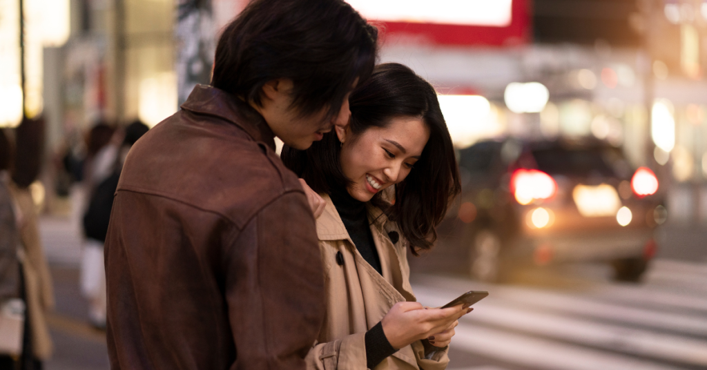 couple-having-date-night-looking-at-their-phones