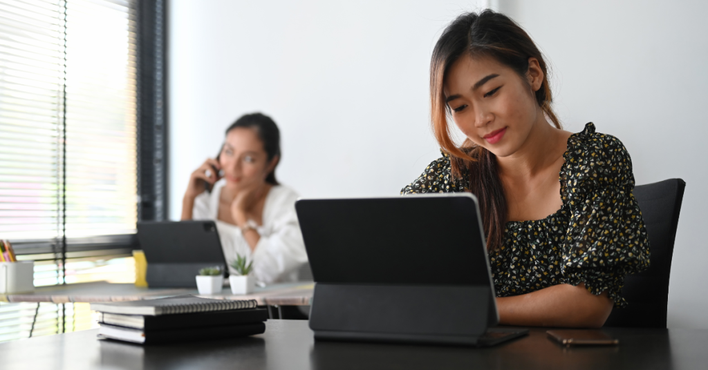 young-woman-working-tablet-modern-office